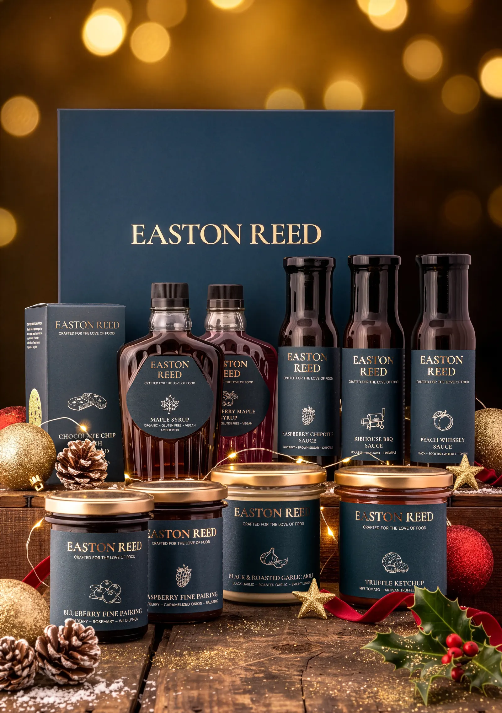 Easton Reed gift box with sauces, maple syrup and Fine Pairings jars in front of golden Christmas lights